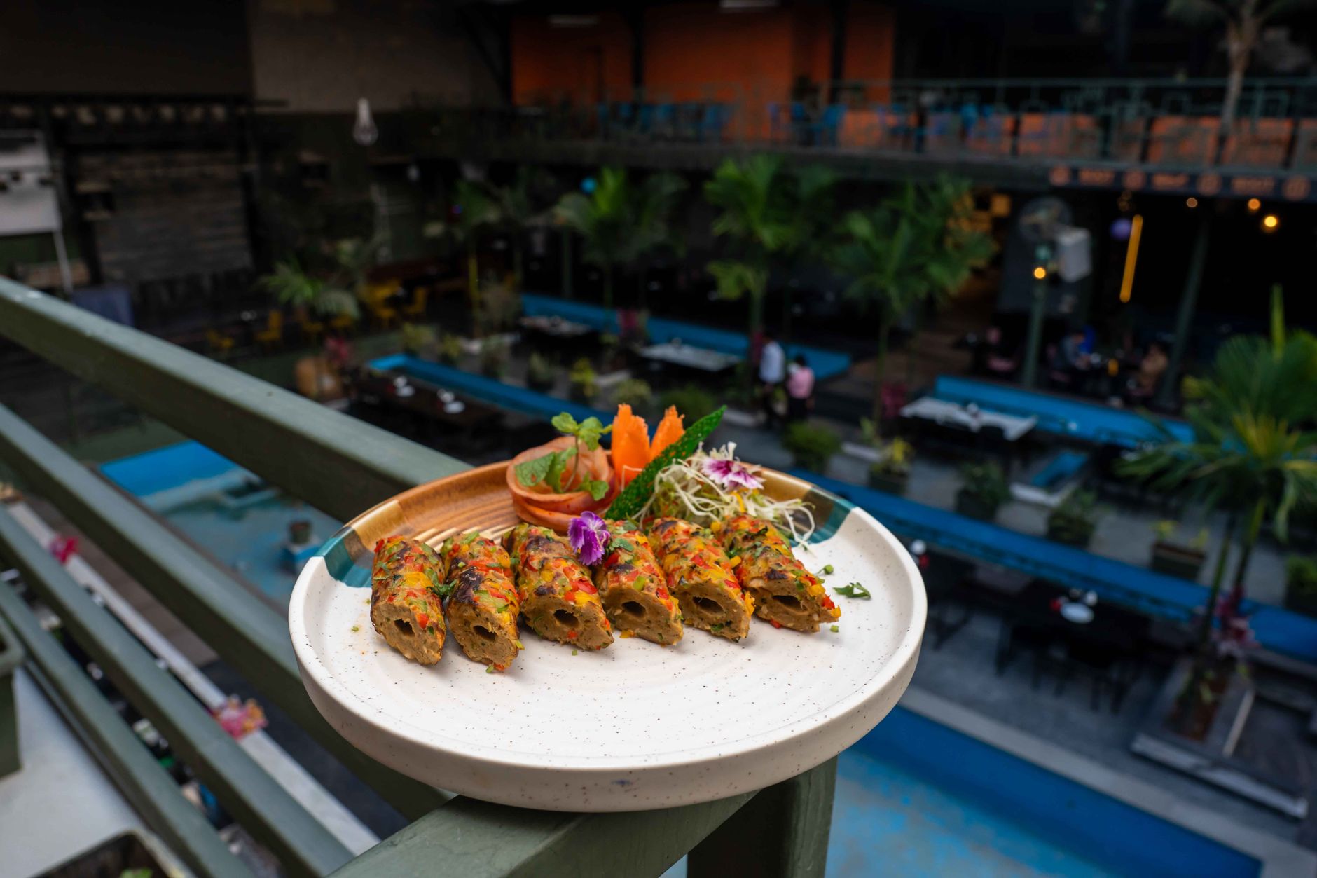 A vibrant vegetarian dish presented on a balcony, overlooking a lively outdoor setting. — Delicious and Diverse Fillings: Pai