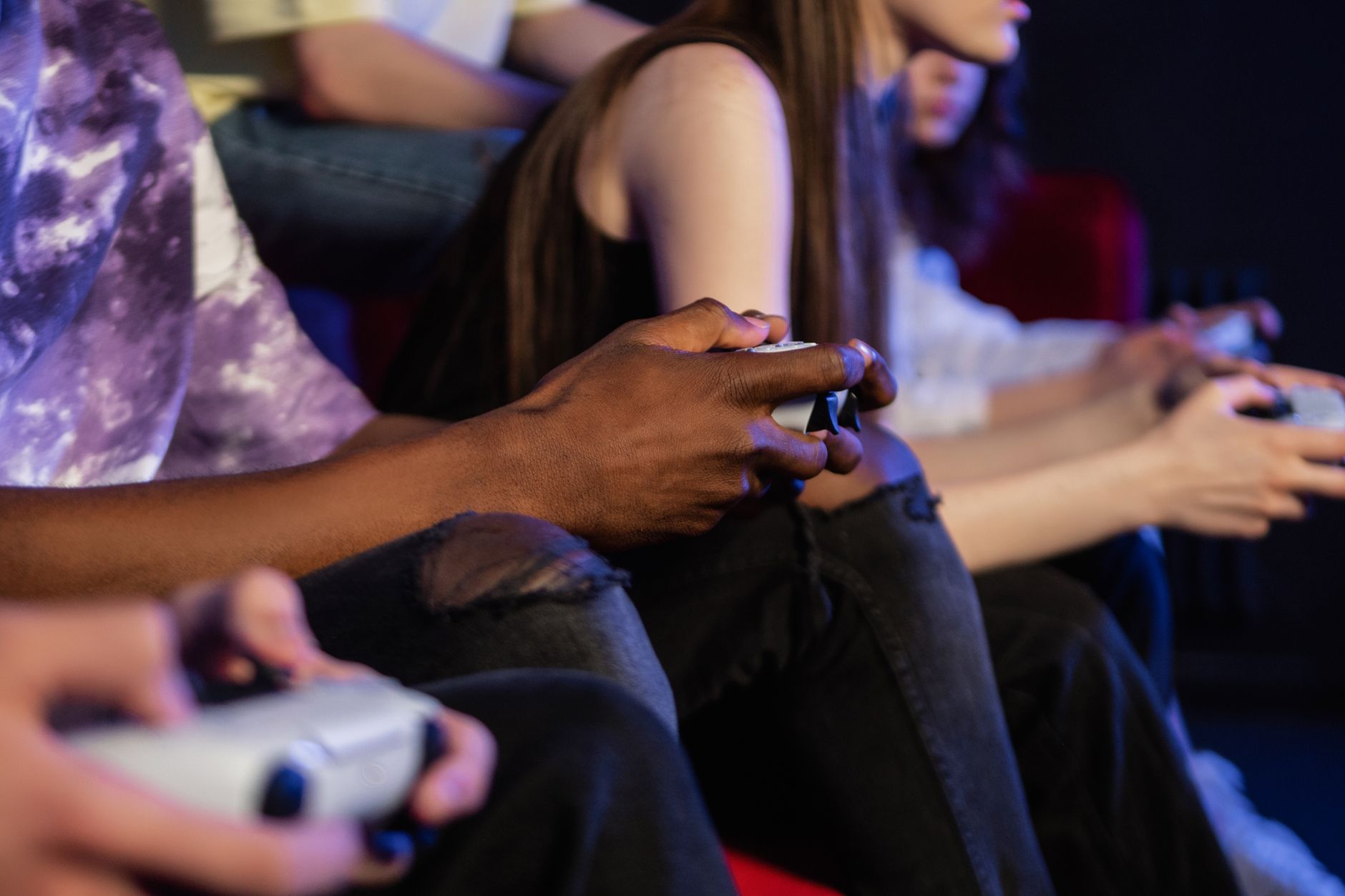 Teens playing video games with controllers, focused and engaged. — Find the Right Casino Site for You