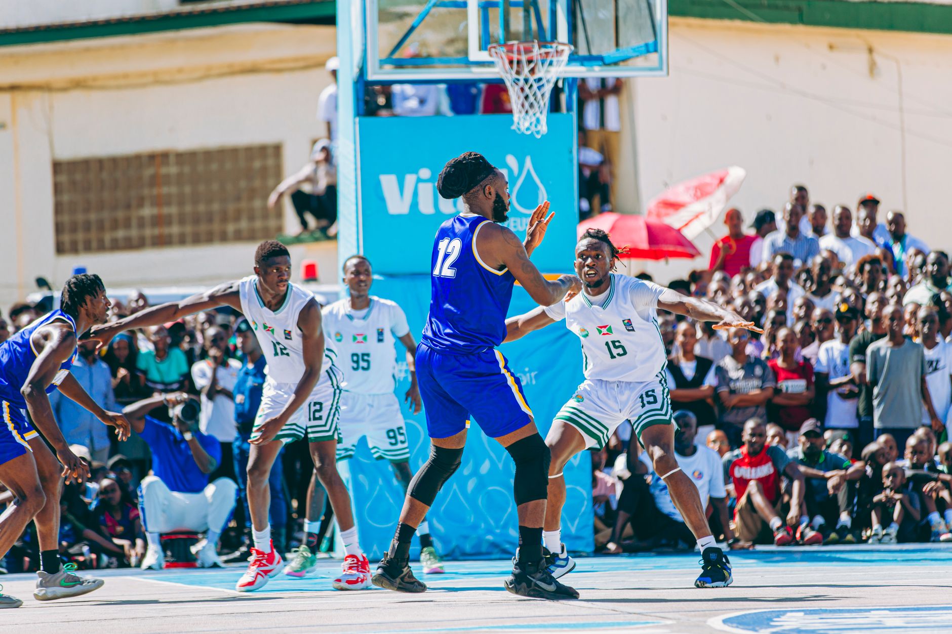 Outdoor basketball game with players competing, surrounded by a large, enthusiastic crowd. — How To Avoid The Pitfalls Of Onl