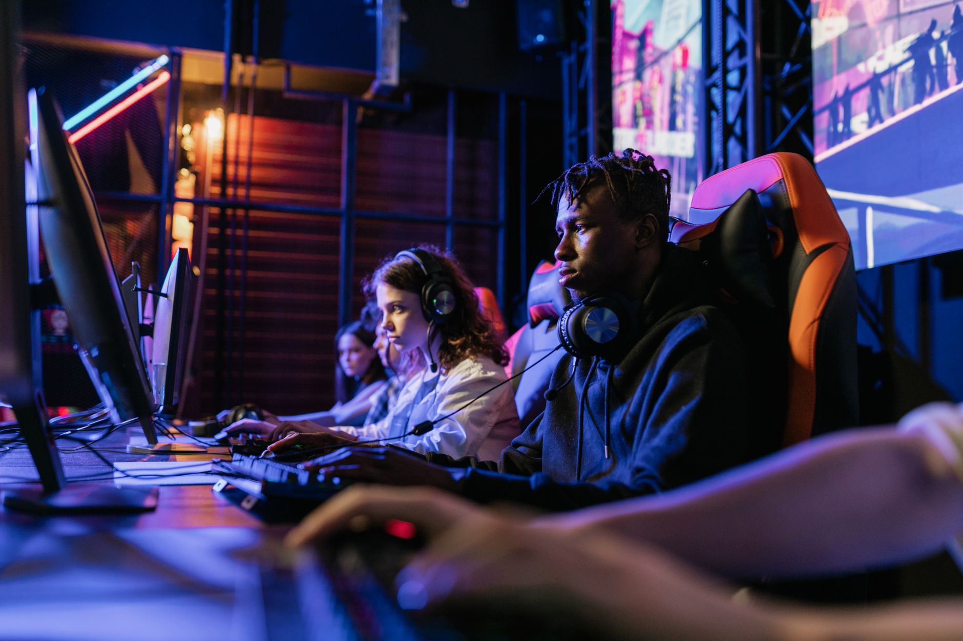 Serious gamers engage in a competitive esports event, highlighting focus and teamwork. — Master the Art of Winning Free Money