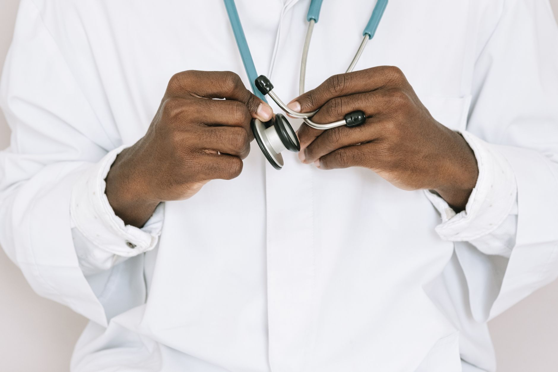A professional doctor holding a stethoscope, focusing on hands and medical tools. — Personal Steam Sauna For Your Needs: Not
