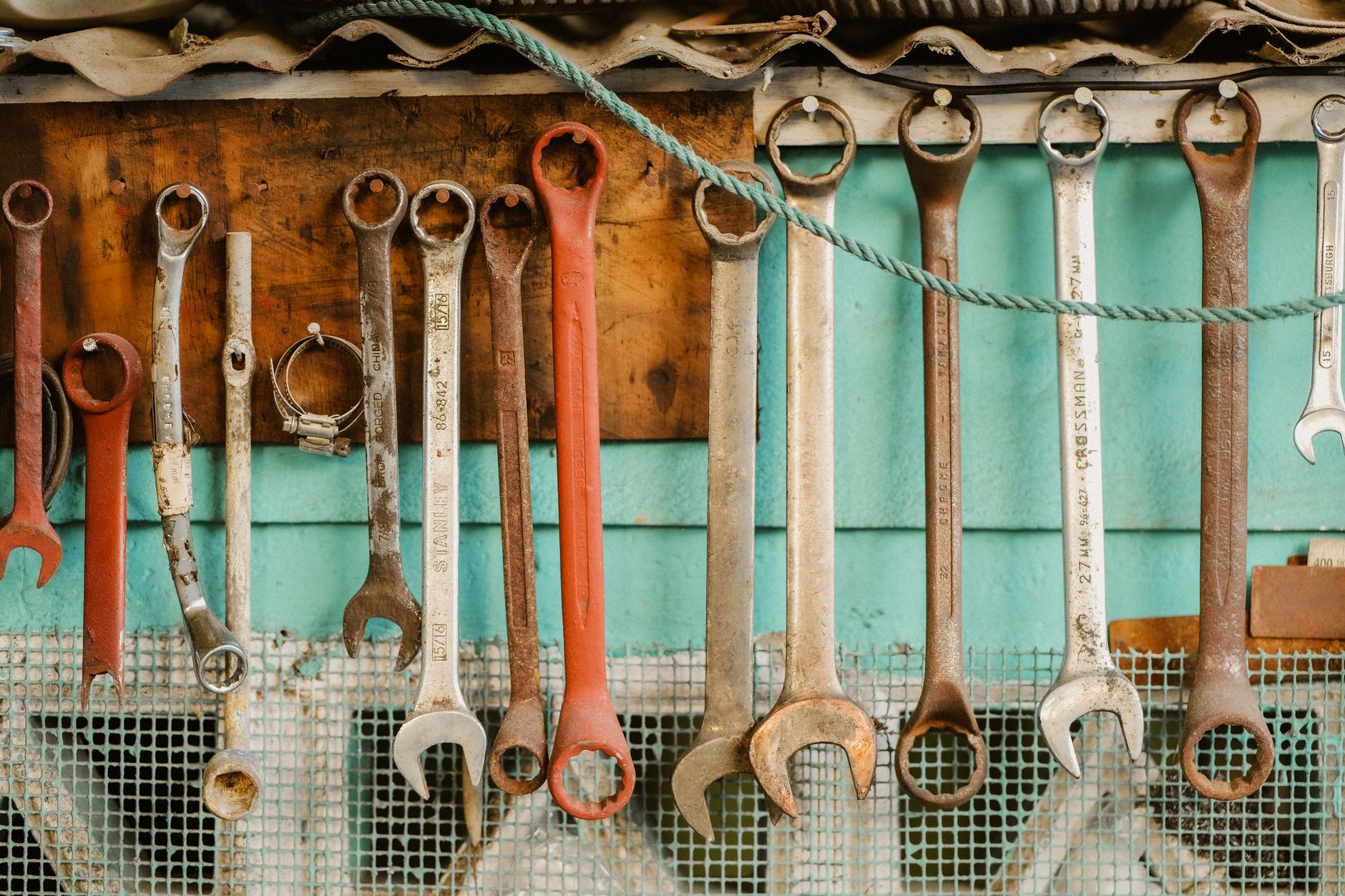 A collection of wrenches hanging neatly on a workshop wall displaying organization. — The Essential Role of HVAC Repair in En