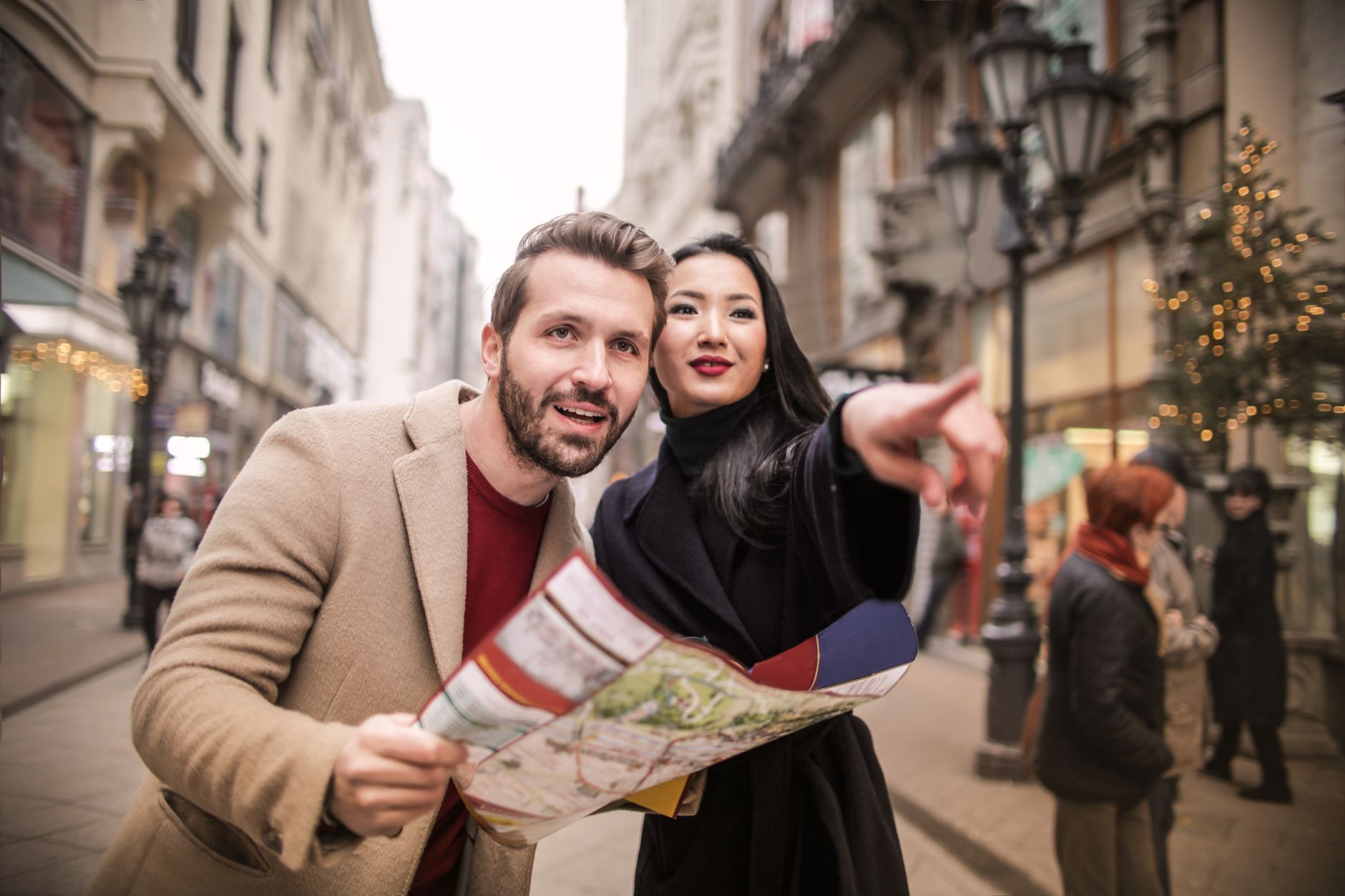 Happy couple exploring urban streets with a map, capturing the essence of travel and adventure. — Tips For enjoying a Great D