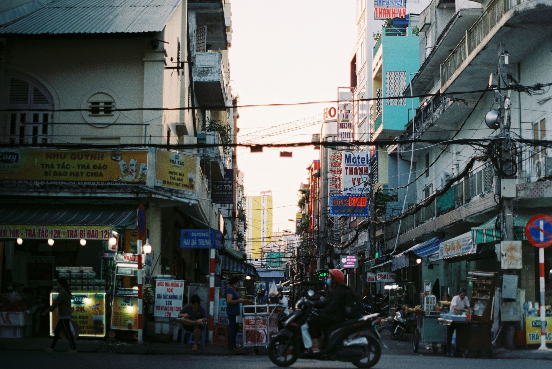Colorful busy street scene in Cần Thơ, Vietnam with vibrant signs and people. — What Happens if You Don't Activate Windows 10
